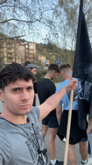 Young men display "Men of Blagoevgrad" flag in public gathering