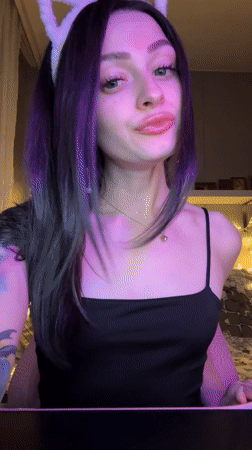 Woman takes selfies wearing cat ears in Reutov bedroom