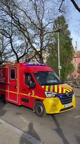 Emergency responders active in central Strasbourg near historic church