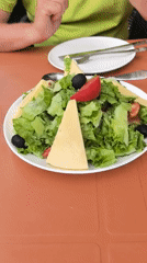 Outdoor café table in Batumi with salads and drinks