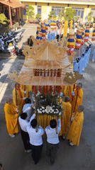 Buddhist procession with monks, palanquin held in Đà Lạt temple