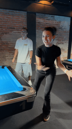 Social gathering at Indonesian pool hall features games and playful antics