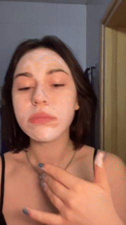 Woman documents morning skincare routine in Odesa bathroom