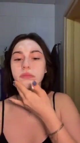 Woman documents morning skincare routine in Odesa bathroom