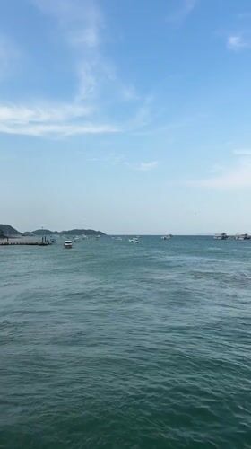 Colorful ferry transports passengers through calm Pattaya waters