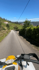 ATV rider travels rural road in northern Portugal