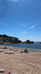 Tourist documents sunny May afternoon in Pržno, Montenegro beaches