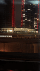 Train passenger films red-lit Moscow buildings at night