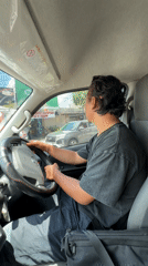 Man sits in driver's seat in Kuta Selatan