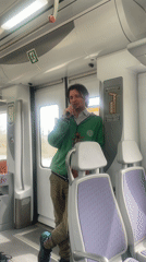 Street musician performs with violin on Spanish train