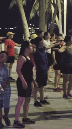 Group participates in outdoor dance activity in Nha Trang