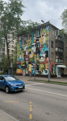 Moscow resident captures neighborhood walk with street art, dog