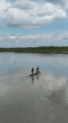 Large-scale log loading operation on PNG river barge site