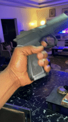 Person handles handgun in Gura Top, Nigeria