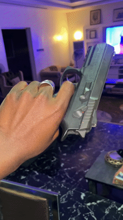 Person handles handgun in Gura Top, Nigeria