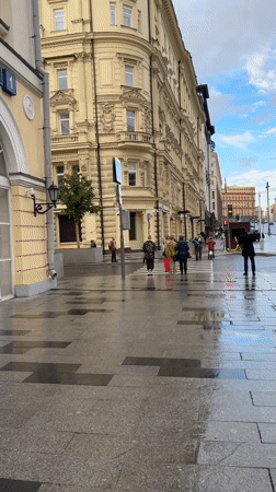 Rainy day street life documented around Moscow's Bolshoi Theatre