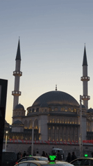 Evening street scenes captured around illuminated mosques in Beyoğlu