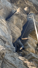 Rock climber scales formation near Parvenets, Bulgaria