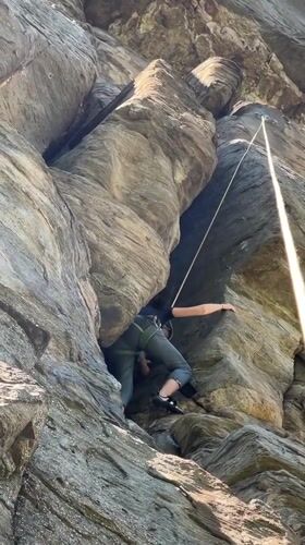 Rock climber scales formation near Parvenets, Bulgaria