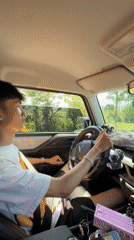 Young man drives VinFast car in Ba Vi, Vietnam