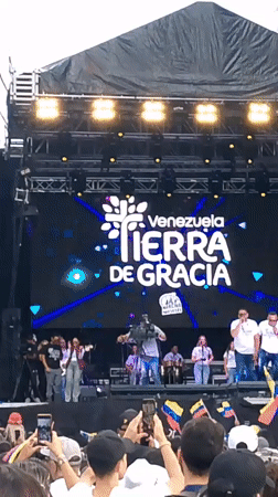 Mass rally fills downtown Caracas streets with flags and music