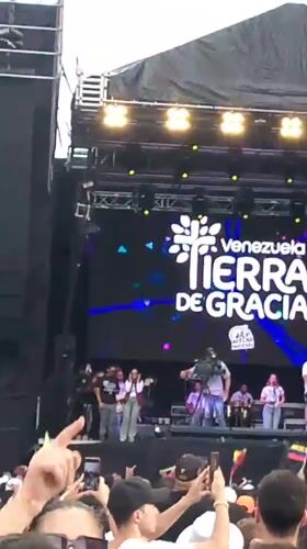 Mass rally fills downtown Caracas streets with flags and music