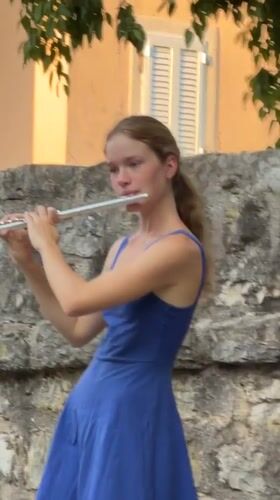 Flute performance against Budva's old stone walls