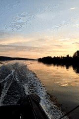 Evening fishing on a quiet Russian river at dusk