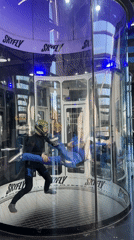 Instructor teaches student floating techniques at Skyfly wind tunnel