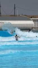 Surfers ride artificial waves at Tel Aviv wave pool