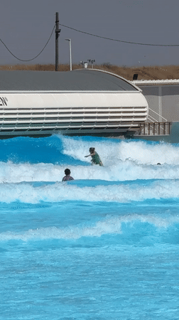 Surfers ride artificial waves at Tel Aviv wave pool