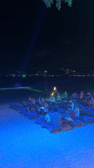 Nighttime beach dining scene captured in Ban Bang Rak