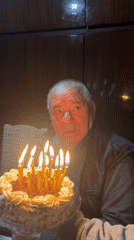 Elderly man celebrates with birthday cake in Bulgarian village