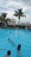 Evening recreation captured at San Andrés Cholula pool, mural