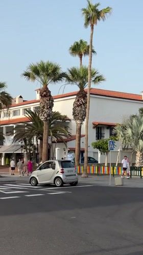 Evening street scenes in Arona, Spain at golden hour