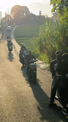 Motorcycle traffic documented on rural Bali street