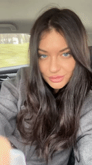 Woman in gray coat spotted in car passenger seat, Moscow