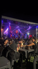 Evening stage performance with colorful lights in Argelès-sur-Mer