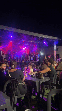 Evening stage performance with colorful lights in Argelès-sur-Mer