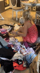 Woman packs for Montenegro trip amid scattered belongings in Wisła
