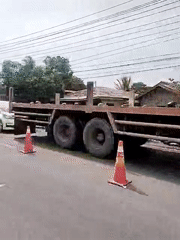 Orange utility truck with crane spotted on Lhokseumawe road