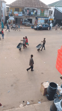 Busy street life documented in Bukuru, Nigeria afternoon
