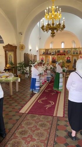 Inside a Russian church with food laid out for a gathering