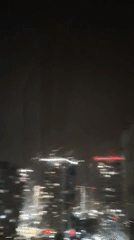 Lightning illuminates nighttime cityscape in Tyumen, Russia