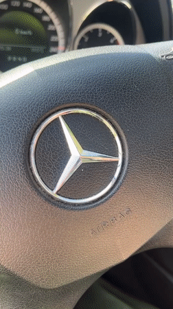 Woman poses for video inside Mercedes-Benz in Varna