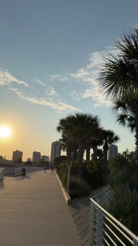 Evening waterfront activities captured along St. Petersburg pier at sunset