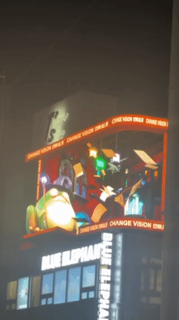 Electronic billboard shows bilingual CGI animation in Shibuya