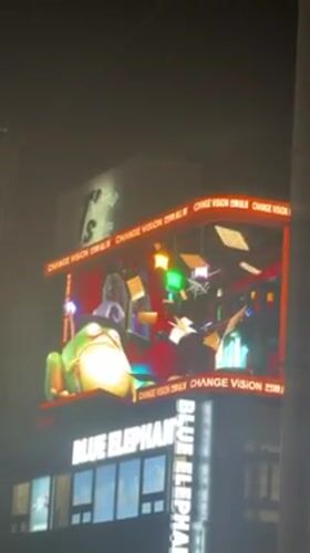 Electronic billboard shows bilingual CGI animation in Shibuya