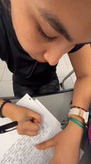 Student studies while queuing online for Tini concert tickets