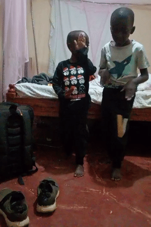 Two barefoot boys observed in indoor residential setting